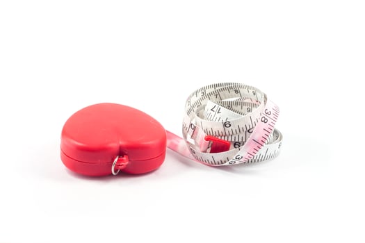 Red measuring tape on a white background photo