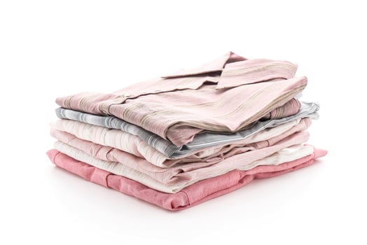 Folded garments on white background photo