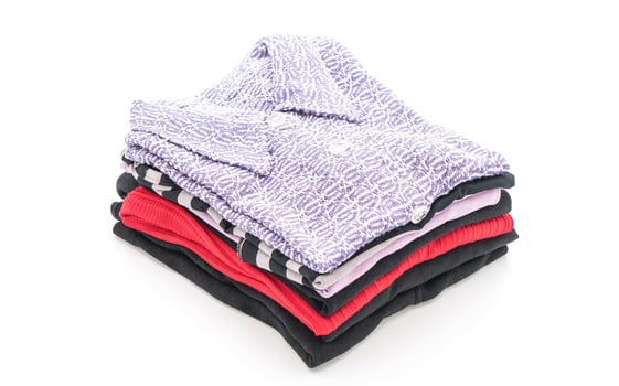 Folded garments on white background photo