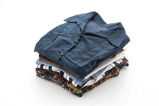 Folded garments on white background photo
