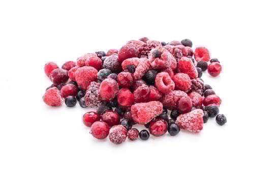 Frozen mixed berries on white background photo