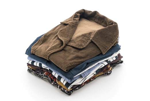 Folded garments on white background photo
