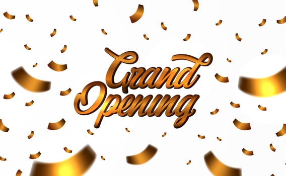 Grand Opening golden text with gold confetti vector