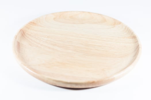Wooden plate on a white background photo