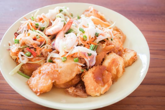 Plate of noodles and spicy shrimp photo