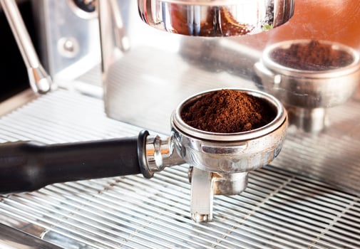 Espresso in a coffee grinder photo