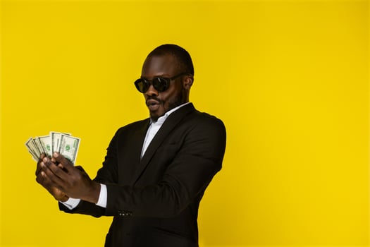 Rich man holds money photo