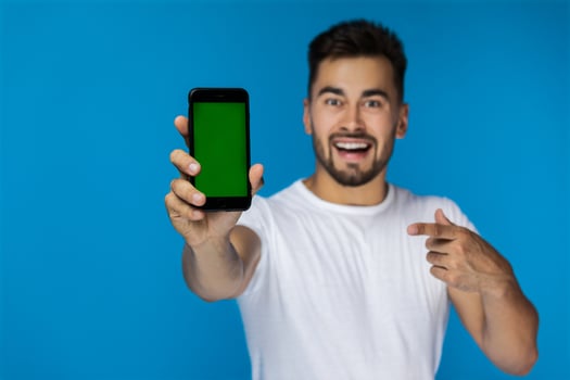 Green screen cell phone in foreground photo