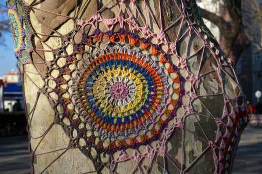 Knitted ornament on a tree photo