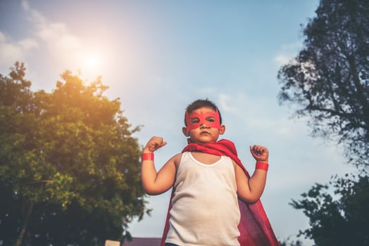 Super boy showing his powerful flying arms photo