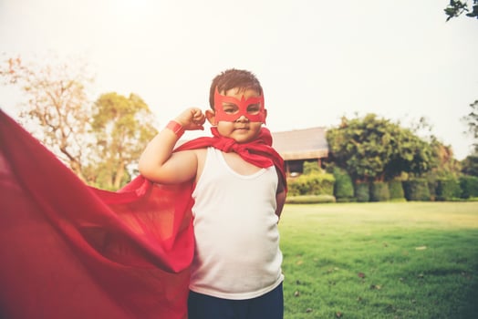 Super boy showing his powerful flying arms photo