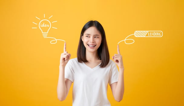 Woman Pointing hands to light bulb photo