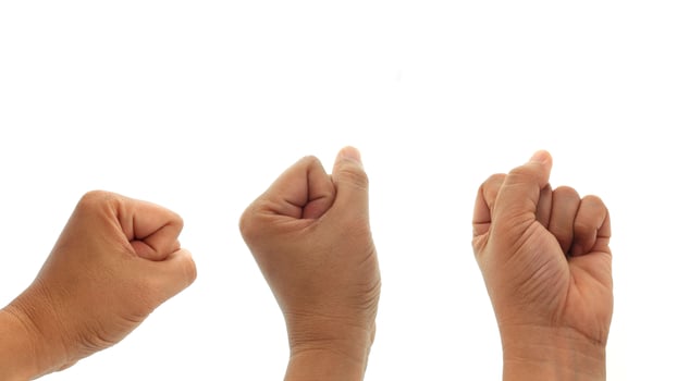 Three fists on a white background photo