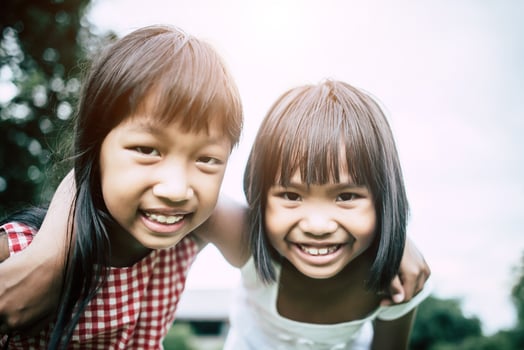 Two little girls friends having fun in the park photo