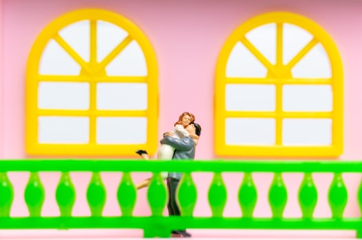 Two figurines of a husband and wife photo
