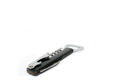Black wine key on white background photo