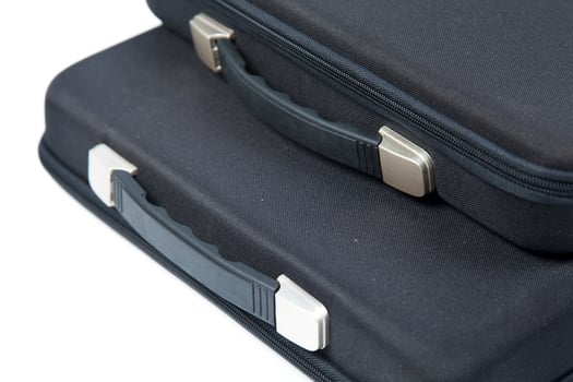 Black briefcases on white background photo