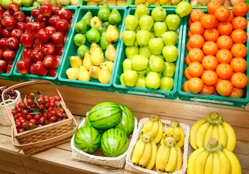 Colorful fruit in stands photo