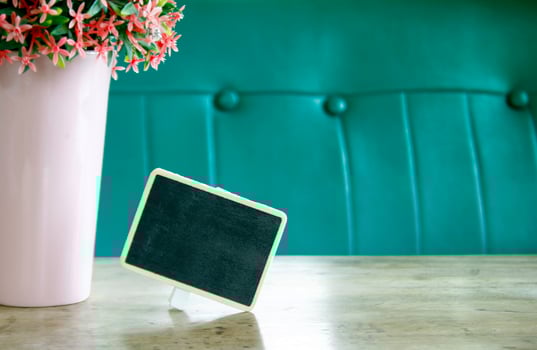 Chalkboard sign and flowers photo