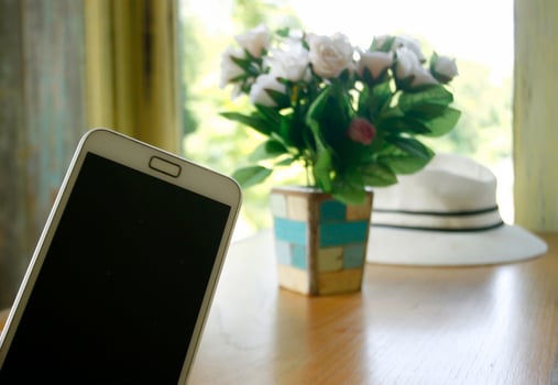 Blank phone and flowers photo