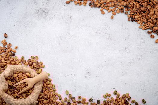 Roasted coffee beans with scoops photo