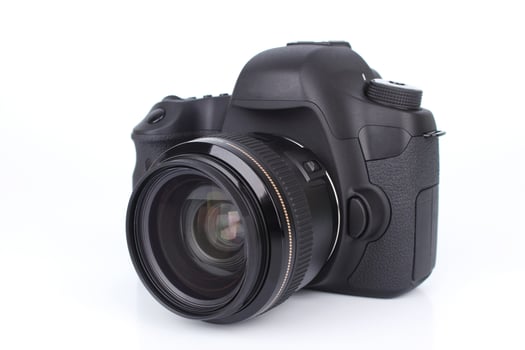 Black DSLR camera on white background. photo