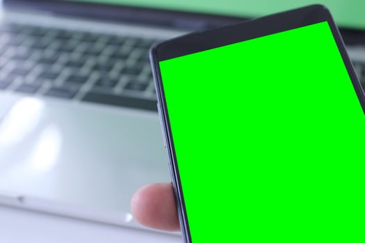 Businessman holding phone mock-up photo