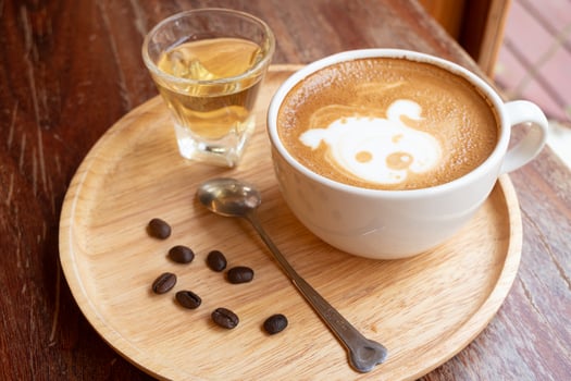 Latte art in a white cup photo