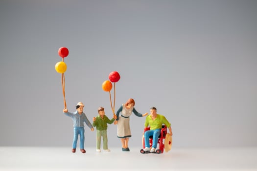 Miniature figurines of a family with balloons photo