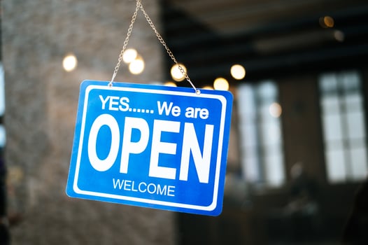 Open sign through the glass window at coffee shop photo