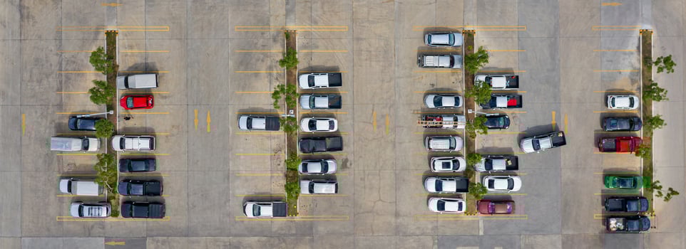 Group of cars in a parking lot photo