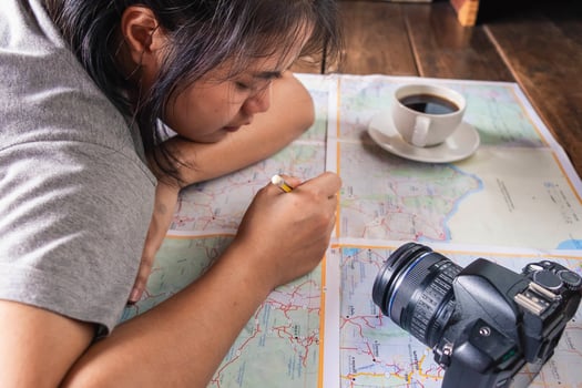 Close-up of a girl making travel plans photo