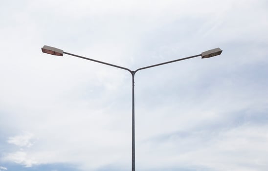 Lamp post under grey sky photo