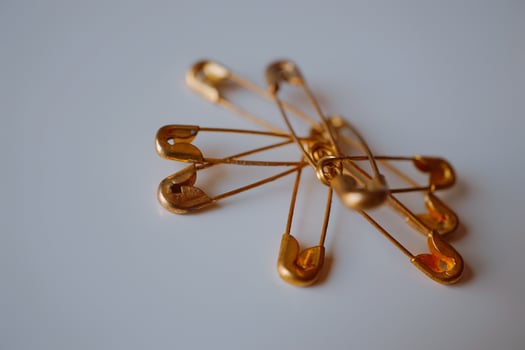 Gold safety pins photo
