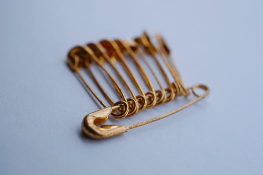 Gold safety pins photo