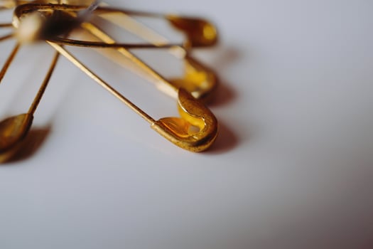 Gold safety pins photo
