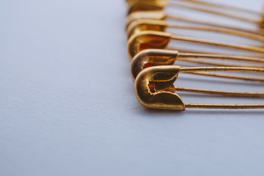 Gold safety pins photo