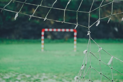 Ripped net on soccer goal photo
