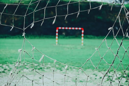Ripped net on soccer goal photo