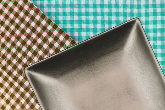 Square plate on cloth photo