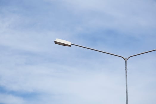 Lamp post under blue sky photo