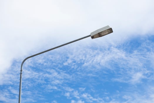 Lamp post under blue sky photo