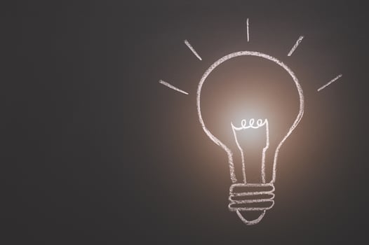 Light bulb on the blackboard photo