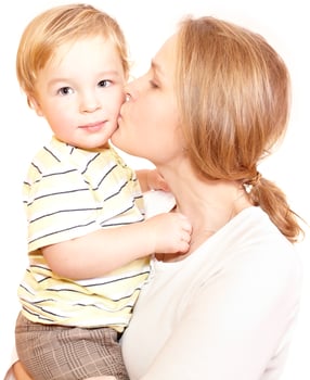 Mother kissing son on a white background photo