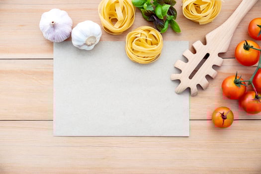 Pasta ingredients with a blank page photo