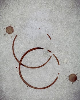 Coffee ring stains on a gray background photo