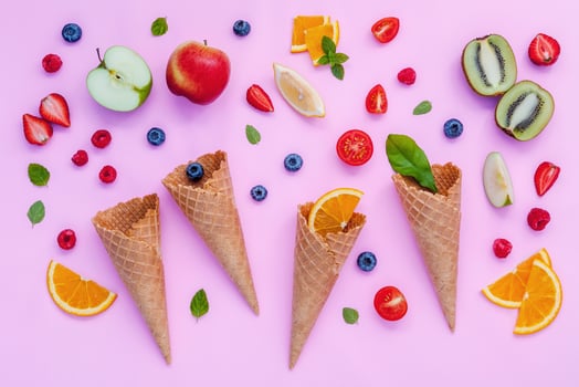 Colorful fruit and ice cream cones photo