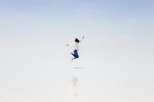 Young woman at Salar de uyuni salt flat in Bolivia photo