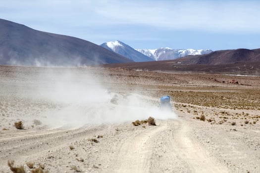 Terrain vehicle in Dali desert at Eduardo Avaroa Andean Fauna National Reserve in Bolivia photo