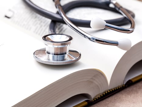 Stethoscope on a textbook photo